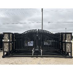 a large gate that has been constructed to look like it is in the middle of nowhere