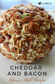 a white plate topped with an oatmeal and bacon cheese ball covered in nuts