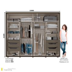 a woman standing in front of a large closet with drawers and clothes on it, measurements