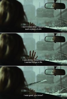 a woman looking at her reflection in the rear view mirror with snow falling on it