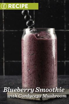 blueberry smoothie with cordeges mushrooms recipe in a jar on a counter