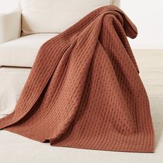 a couch with a blanket on top of it