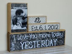 two wooden blocks with pictures on them and the words, i love you more today than yesterday