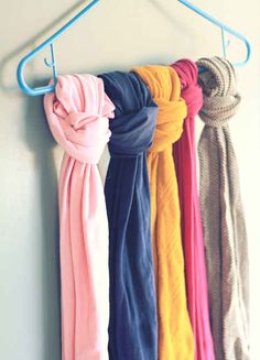 an image of scarves hanging on a rack with text that reads 8 keep your scarves or tights straight by tying them to a hanger