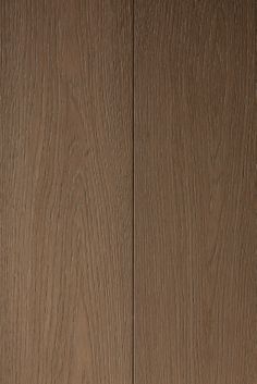 a close up view of the wood grains on this flooring material, which looks like it has been painted brown