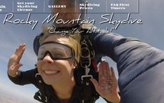 a woman is skydiving with her hands in the air