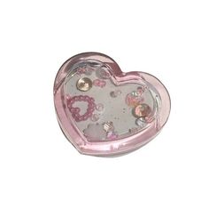 a pink heart shaped clock with hearts on it