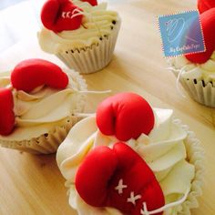 cupcakes with red and white frosting decorated like football gloves on top of each other