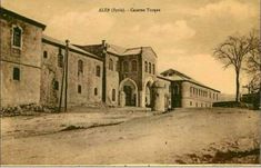 an old black and white photo of a church in the middle of town with trees on both sides