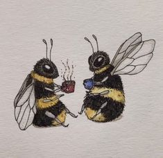 two bees are drinking coffee together