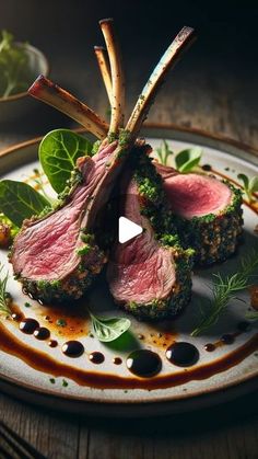 a white plate topped with meat and veggies on top of a wooden table