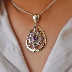 A gorgeous, handcrafted amethyst pendant necklace is the perfect way to wear this natural gemstone! This sterling silver vintage style features a delicate amethyst gemstone in the middle and around the piece. The overall look of this piece makes it a timeless addition to any outfit. We Assure You of Satisfaction With Our High-Quality Jewelry * Sterling Silver * Natural Gemstone * Nickel free * Made in India With Love And High Standards ※ Please let us know if you have any questions or requests. Amethyst Pendant Necklace, Amethyst Necklace Pendant, Jewelry Sterling Silver, Amethyst Pendant, Amethyst Gemstone, High Quality Jewelry, Sterling Silver Pendant, Sterling Silver Pendants, Pendant Necklaces