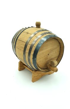 a wooden barrel sitting on top of a wooden stand