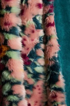 an animal fur coat with multicolored spots on it