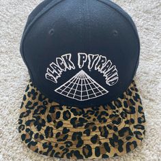 Black Pyramid Hat New Without Tags. Never Been Worn. Includes Adjustable Strap For Custom Fit Black Cotton Trendy Snapback Hat, Trendy Black Snapback Hat With Flat Bill, Trendy Black Cotton Snapback Hat, Fitted Black Cotton Hats, Fitted Black Snapback Hat With Flat Brim, Fitted Black Snapback Hat, Black Fitted Baseball Cap Casual, Black Fitted Casual Baseball Cap, Adjustable Black Brimmed Snapback Hat