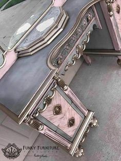 an ornately decorated desk with mirrors on it