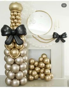 balloons are stacked on top of each other in front of a mirror and fireplace mantel