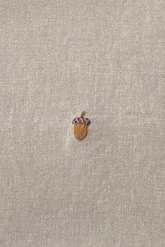 an embroidered piece of cloth with a small patch on the back of it's side