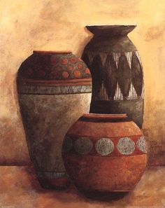 three vases sitting on top of a table in front of a brown and white wall