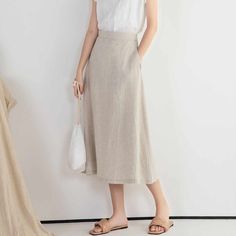 "DETAIL * 100% Linen * Back elastic * Two side pockets * A Line skirt * Below knee length skirt * Wash by hand or machine with cold water * The model is 170cm (5′ 7″) tall with a 66cm (26\") waist. She is wearing a XS/S in natural color. * Choose CUSTOM Order if you Need a better fit Can't find your size in our size Chart Change the Style Chang the Length Your Height is not Between 5'1\" - 5\"9\" SIZING AND FIT, Garment size as follow XS/S Waist 66-71cm Hips 100cm Length 75cm Weight suggest with Linen A Line Skirt, Summer Workwear Knee-length Skirt, Chic Long Pencil Skirt With Pockets, Spring Solid Color Midi Bottoms, Casual Pencil Skirt For Summer Workwear, Summer Bottoms With Pockets, Midi Length, Solid Color Midi Skirt For Summer, Casual Midi Length Pencil Skirt For Day Out, Summer Solid Color Midi Skirt