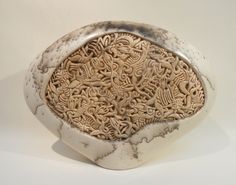 a white bowl with intricate designs on it