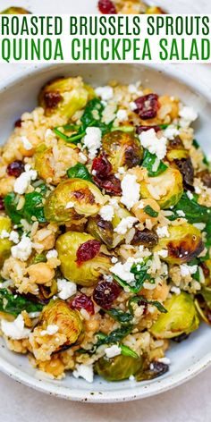 roasted brussel sprouts and quinoa chickpea salad in a white bowl