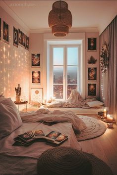 a bedroom with lights and pictures on the wall above the bed, along with candles