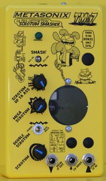 a yellow machine with buttons and knobs on it