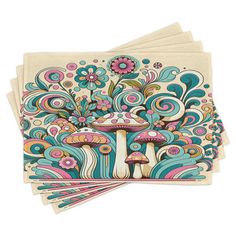 four coasters with colorful designs on the front and back, each featuring an image of a mushroom