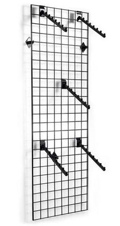 a wall mounted rack with three hooks and four pegs on it, hanging from the side