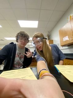 two people in a lab looking at the camera