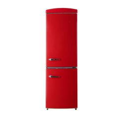 a red refrigerator freezer sitting on top of a white wall