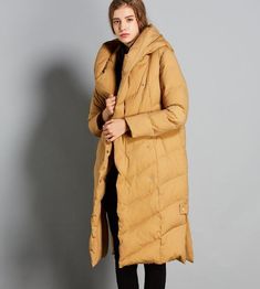 This down coat make with 90% duck down ,very warm in the winter .also could be custom made for any size. This is a winter down jacket fill with down.we design it with a very thick and warm style.this hooded down jacket could keep you very warm in the cold winter.the side pockets is very useful.a unique design women winter coat. Material: 90% duck down ,polyester Style: Casual Package Contents: 1 x down coat Size M:Length:110cm chest:110cm shoulder:40cm sleeve:59cm L:Length:110cm chest:114cm shou Winter Down Outerwear, Winter Down Puffer Outerwear, Winter Down Puffer Jacket In A Solid Color, Winter Down Puffer Jacket In Solid Color, Winter Down Puffer Jacket, Solid Duck Down Outerwear For Cold Weather, Duck Down Outerwear With Detachable Hood For Fall, Long Sleeve Duck Down Outerwear, Solid Down Outerwear For Fall