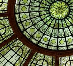 the inside of a large stained glass dome