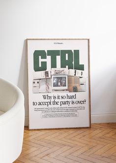 a white chair sitting in front of a poster on the floor next to a wall