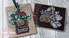 two christmas cards with pine cones and evergreens on them, one has a tag that says season's greetings