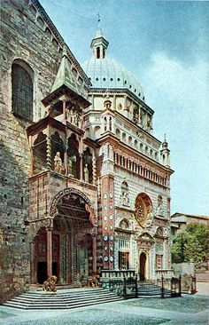 an old painting of a large building with a clock on it's side and stairs leading up to the entrance