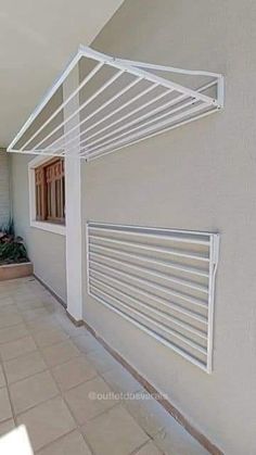 an outside view of a building with white shutters