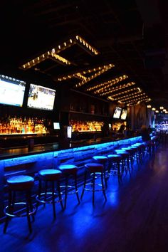 the bar is lit up with blue lights