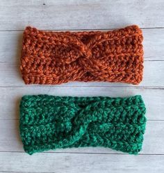 two crocheted headbands sitting next to each other