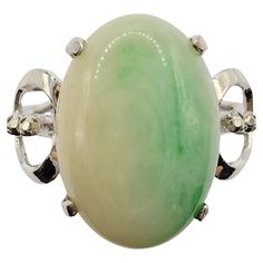 Introducing our exquisite Vintage Solitaire White & Green Jade Ring in White Gold, a captivating piece that seamlessly combines the elegance of white gold with the allure of a stunning cabochon cut jade gemstone. This unique ring showcases a remarkable 13.40mm x 9.40mm cabochon cut jade, set in a lustrous white gold band. The focal point of this ring is the mesmerizing cabochon cut jade gemstone. Known for its smooth, rounded surface and captivating color, the jade exhibits a beautiful blend of Green Rings, Jade Gemstone, White Gold Set, Jade Ring, Unique Ring, White Gold Band, Green Jade, Belleza Natural, Jade Green