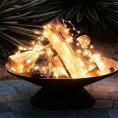 a bowl filled with logs covered in lights