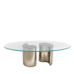 a glass and metal coffee table with two circular bases on each side, in front of a white background