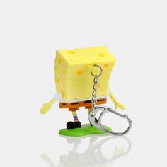 a keychain with a piece of cheese attached to it