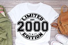 a t - shirt with the words limited est 2000 printed on it next to shoes and backpack