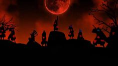 a group of people standing on top of a hill under a red moon