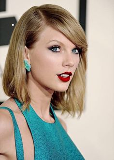 taylor swift with red lipstick and blue eyeshadow