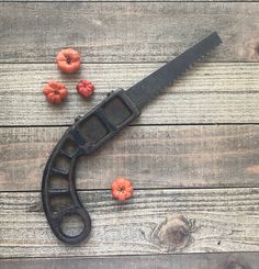 a knife and some fruit on a wooden table