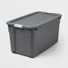 a gray plastic storage box with lid and handles on an isolated white back ground surface