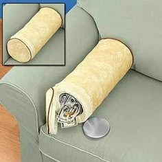 a roll of toilet paper on the back of a couch